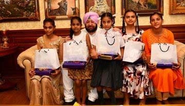 5-girls-tie-rakhi-with-cm-a.jpg