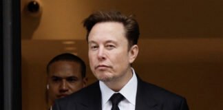 Elon Musk talking about AI and future of work, robots automating industries, AI technology revolution 2025