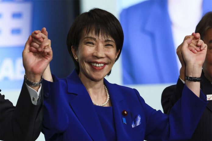 sanae-takaichi-first-female anae Takaichi waving to supporters after being elected Japan’s first female Prime Minister