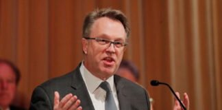 New York Fed President John Williams speaking at an economic policy event.