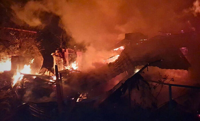 Russian Strikes Intensify in Kyiv Kyiv skyline shrouded in smoke after Russian missile strikes; civilians seek shelter amid blackouts.