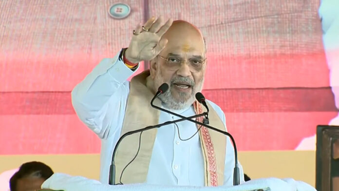 amit-shah-warns-of-jungle-r Amit Shah addressing a massive crowd in Patna warning voters against the return of jungle-raj under RJD rule.
