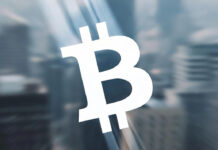 Bitcoin Slumps Sharply, Wiping Out 2025 Gains in Its Worst Monthly Drop Since 2022 Bitcoin coin graphic showing price decline during a major market downturn.