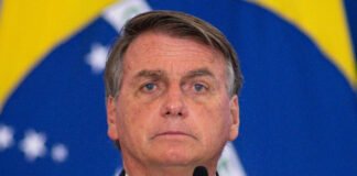 Former Brazilian President Jair Bolsonaro escorted by authorities after his arrest.