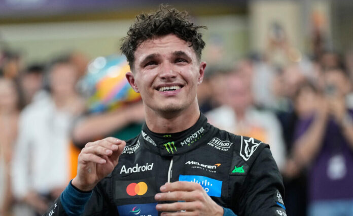 Lando-Norris-Wins-2025-Form Lando Norris celebrates after winning the 2025 Formula One World Championship at the Abu Dhabi Grand Prix.