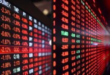 Global Markets Sink as Trump Tariff Threats Trigger Recession Jitters and Wipe Out $1 Trillion Global stock market screens showing sharp declines after Trump tariff threats.