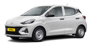 Hyundai Prime Taxi range with factory-fitted CNG parked outside a Hyundai dealership in India, showcasing Prime HB hatchback and Prime SD sedan models.