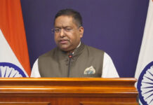 India Raises Concerns with US Over Mass H-1B Visa MEA spokesperson Randhir Jaiswal addressing press briefing on H-1B visa delays and overseas Indian citizens issues December 2025
