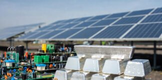 Silver bars and solar panels symbolizing silver’s role in industry and energy transition