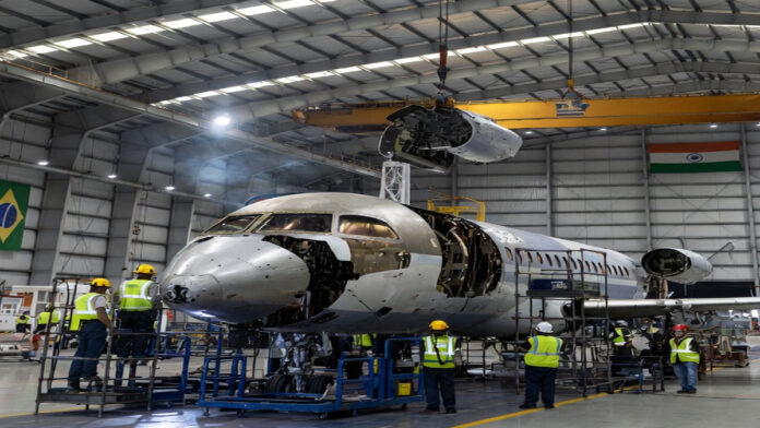 adani-embraer-aircraft-manu Adani Defence and Embraer executives announcing aircraft manufacturing partnership in India