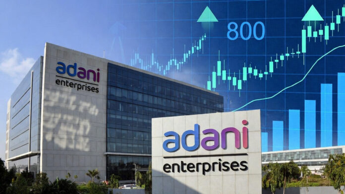 adani-enterprises-ncd-issue Adani Enterprises office building with financial charts symbolizing strong NCD investor demand
