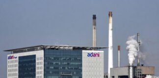 Adani Power corporate office with power plant infrastructure in the background