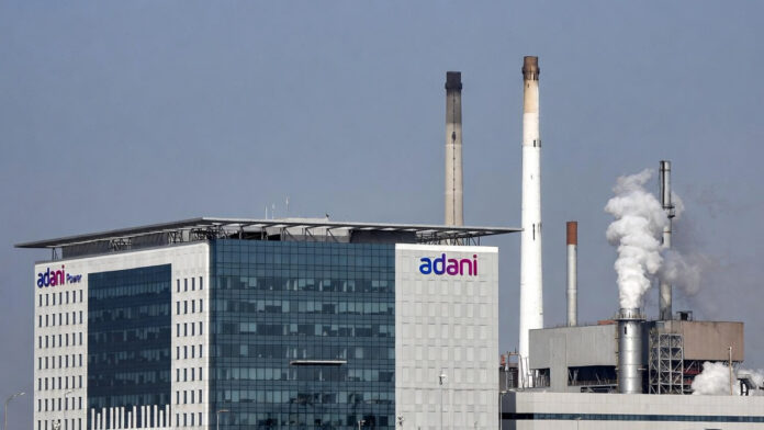 adani-power-q3-fy26-results Adani Power corporate office with power plant infrastructure in the background