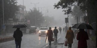 Rainy morning in Delhi with fog and cold winds affecting daily life