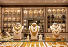 Gold Surges Past ₹1.66 Lakh, Silver Crosses ₹3.70 Lakh: Bullion Prices Hit All-Time Highs Amid Global Turmoil Gold and silver bars displayed at a bullion market amid record price surge in Delhi