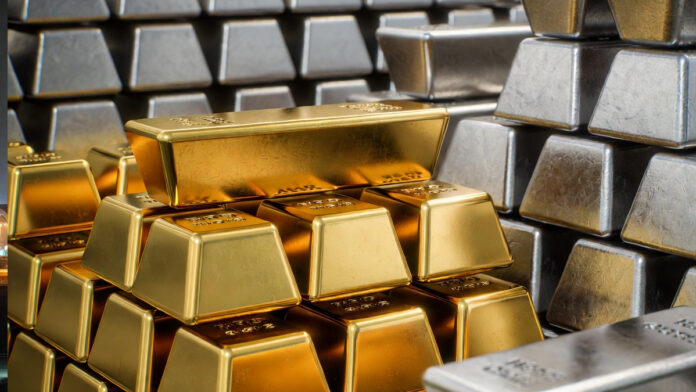 gold-silver-price-record-hi Gold and silver bars displayed at a bullion market in Delhi as prices hit record highs