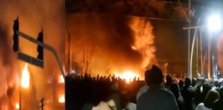Protesters in Iran facing security forces amid intensified demonstrations and communication restrictions.