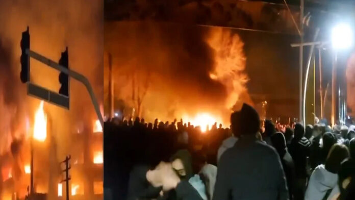 iran-protests-escalation-ca Protesters in Iran facing security forces amid intensified demonstrations and communication restrictions.