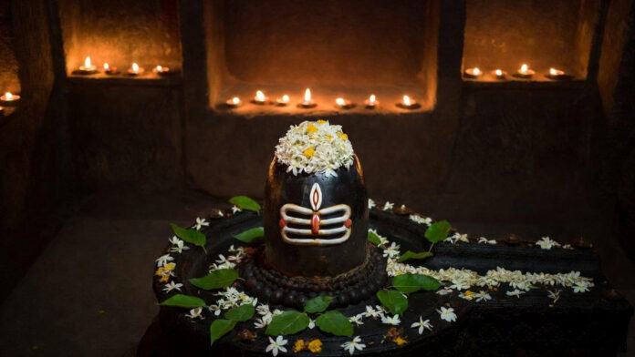 mahashivratri-2026-puja-tim Devotees offering prayers to Lord Shiva on Mahashivratri night