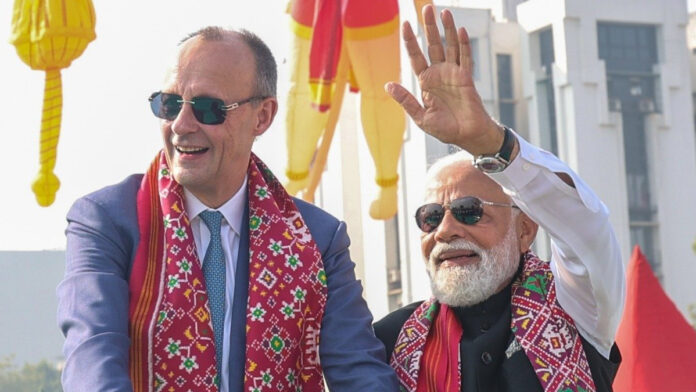 modi-merz-sabarmati-ashram- PM Narendra Modi and German Chancellor Friedrich Merz pay tribute to Mahatma Gandhi at Sabarmati Ashram