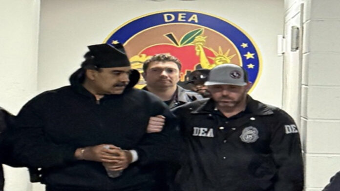 nicolas-maduro-us-court-dru enezuelan President Nicolas Maduro entering US federal court in Washington for drug trafficking hearing on January 5, 2026, with security detail.
