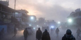 Severe cold wave in North India with dense fog and people walking in freezing temperatures
