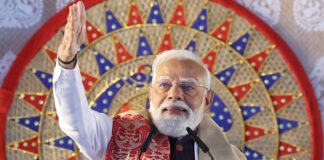 PM Narendra Modi addressing a public rally in Singur, West Bengal, highlighting new development projects.