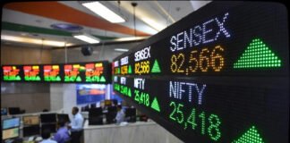 BSE Sensex and Nifty indices showing green upward arrows on digital display board at Bombay Stock Exchange