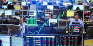 Indian stock market screen showing Sensex and Nifty rising in early trade.