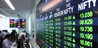 Sensex and Nifty trading screens showing gains on New Year 2026