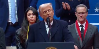Donald Trump speaking at a podium while addressing US economic policy