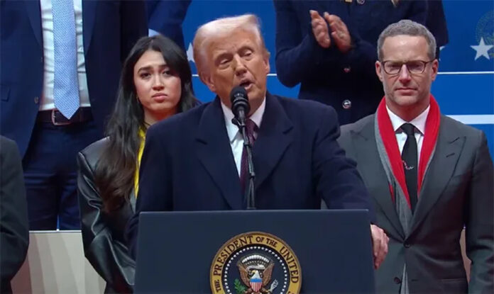 trump-tariffs-us-investment Donald Trump speaking at a podium while addressing US economic policy