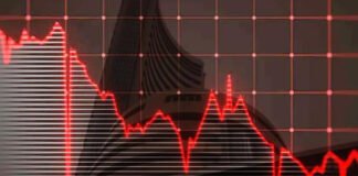 Traders monitor red screens at Bombay Stock Exchange during Sensex 558-point decline on February 12, 2026