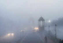 Delhi Fog Alert: IMD Issues Yellow Warning for Tuesday as February 2026 Turns Coldest Since 2022 Dense morning fog reduces visibility over Delhi roads and landmarks on a cold February day in 2026