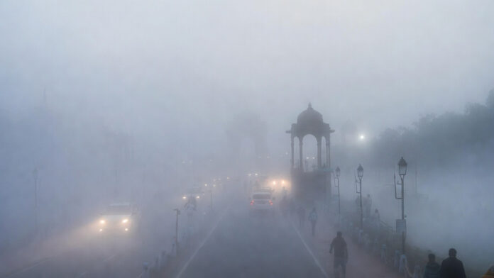 delhi-dense-fog-yellow-aler Dense morning fog reduces visibility over Delhi roads and landmarks on a cold February day in 2026