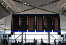 Dubai International Airport Suspends All Flights Indefinitely Amid Regional Airspace Concerns Departure board showing canceled flights at Dubai International Airport amid airspace suspension