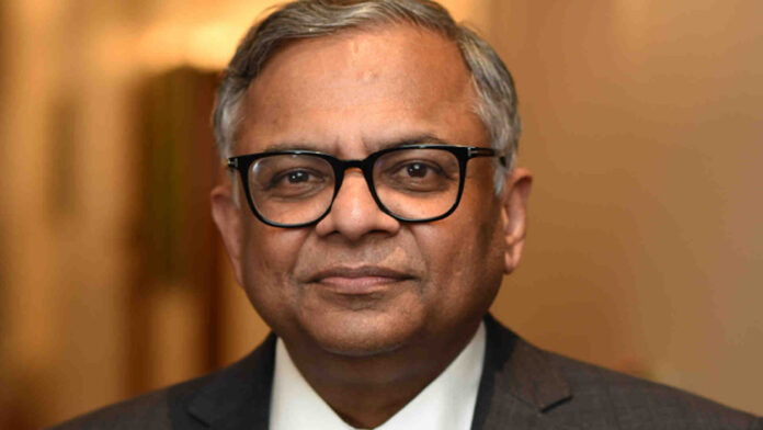 n-chandrasekaran-tata-sons- N. Chandrasekaran speaking at a corporate event with Tata Sons headquarters in the background