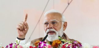 Prime Minister Narendra Modi inaugurating Meerut Metro with officials on stage