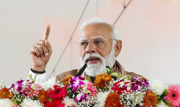 pm-modi-meerut-metro-inaugu Prime Minister Narendra Modi inaugurating Meerut Metro with officials on stage