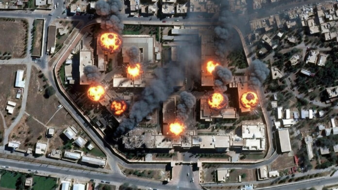 tehran-airstrike-satellite- Satellite image showing damage and smoke near secure compound in Tehran amid Israel-US airstrikes