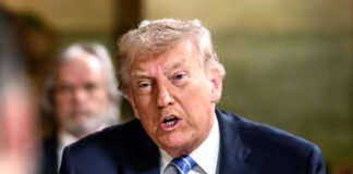 Donald Trump speaking about global tariffs at a press briefing