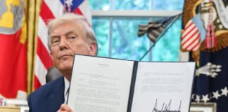 Donald Trump announcing new global tariff policy during press briefing