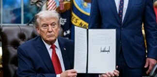 Donald Trump announcing tariff policy during press briefing