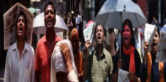 Hot sunny day in Delhi with people walking under strong sunlight during record March heat