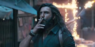 Ranveer Singh in an intense action scene from the Dhurandhar 2 trailer featuring explosive background visuals