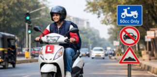 Teenager riding a small 50cc gearless scooter with a learner driving license in India