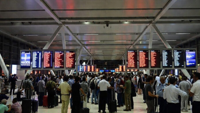 dubai-airport-flight-crisis Passengers waiting at Dubai International Airport as Middle East crisis causes flight cancellations and ticket price surge