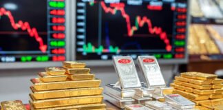 Gold and silver bars displayed in a jewelry market as bullion prices fall sharply in Delhi after Holi