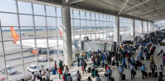 India airfare caps removed domestic flights ticket prices airport passengers boarding plane