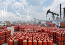 India Moves to Secure LPG Supply: Government Revises Natural Gas Priority Amid West Asia Conflict LPG gas cylinders stacked at an Indian distribution center as the government revises natural gas allocation to secure domestic LPG supply.